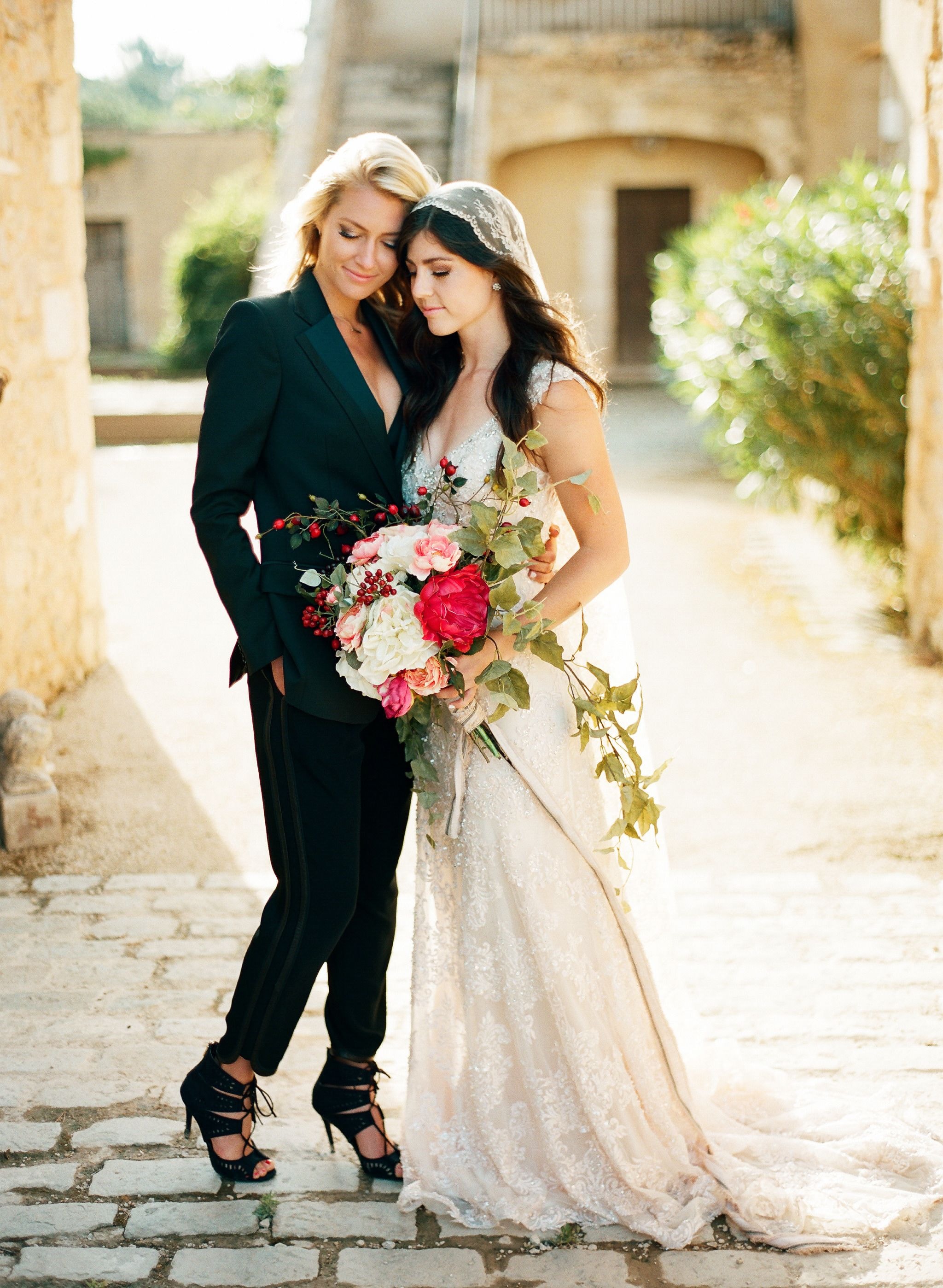 Same-sex couple at a romantic destination wedding ceremony